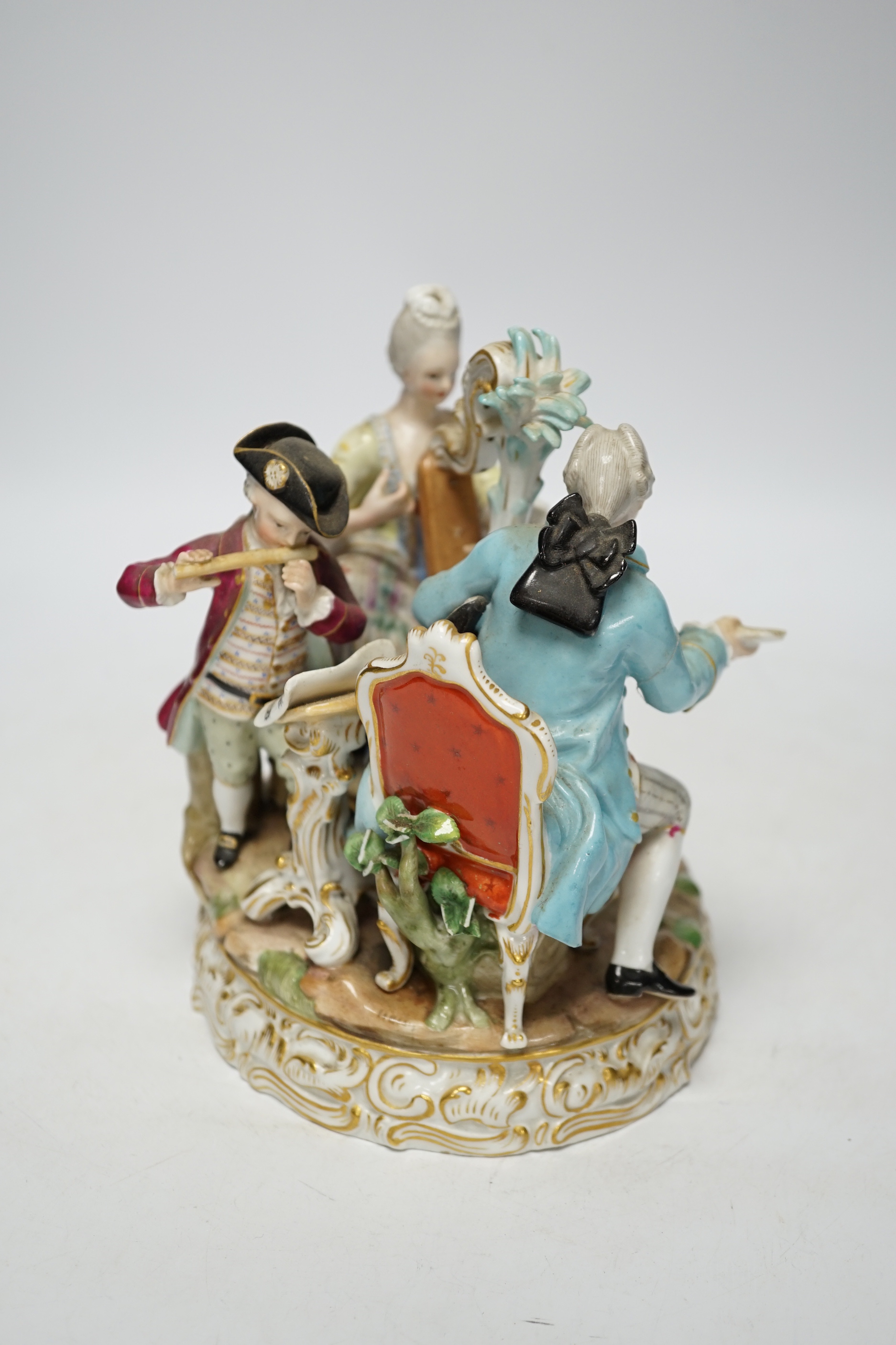 An early 20th century Meissen figure group of musicians, stamped D48, 18cm